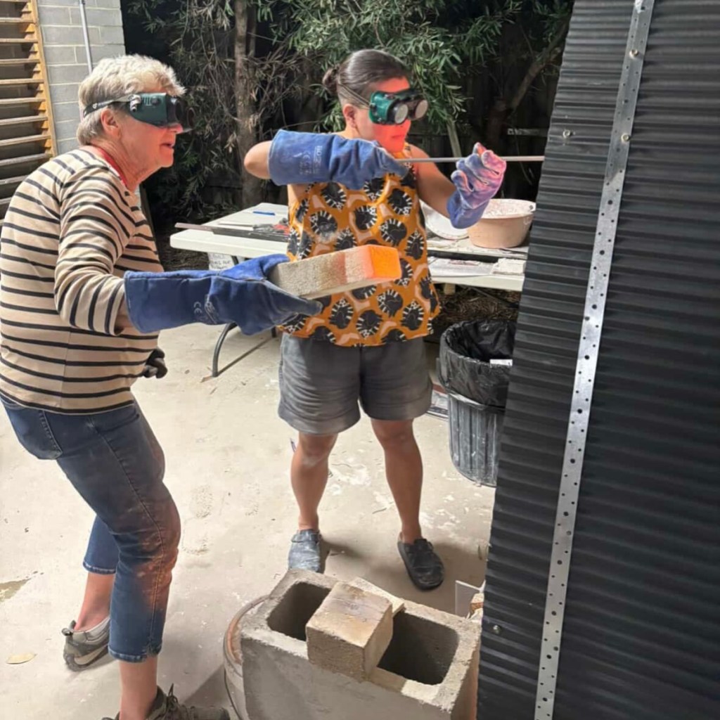 Maryke and Kris firing the kiln
